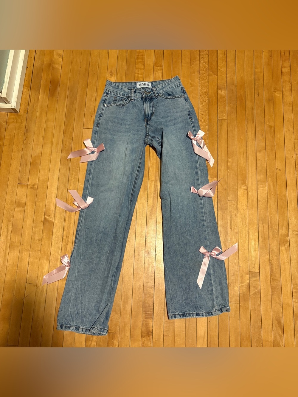 Light Blue Straight-Leg Jeans with Pink Ribbon Accents